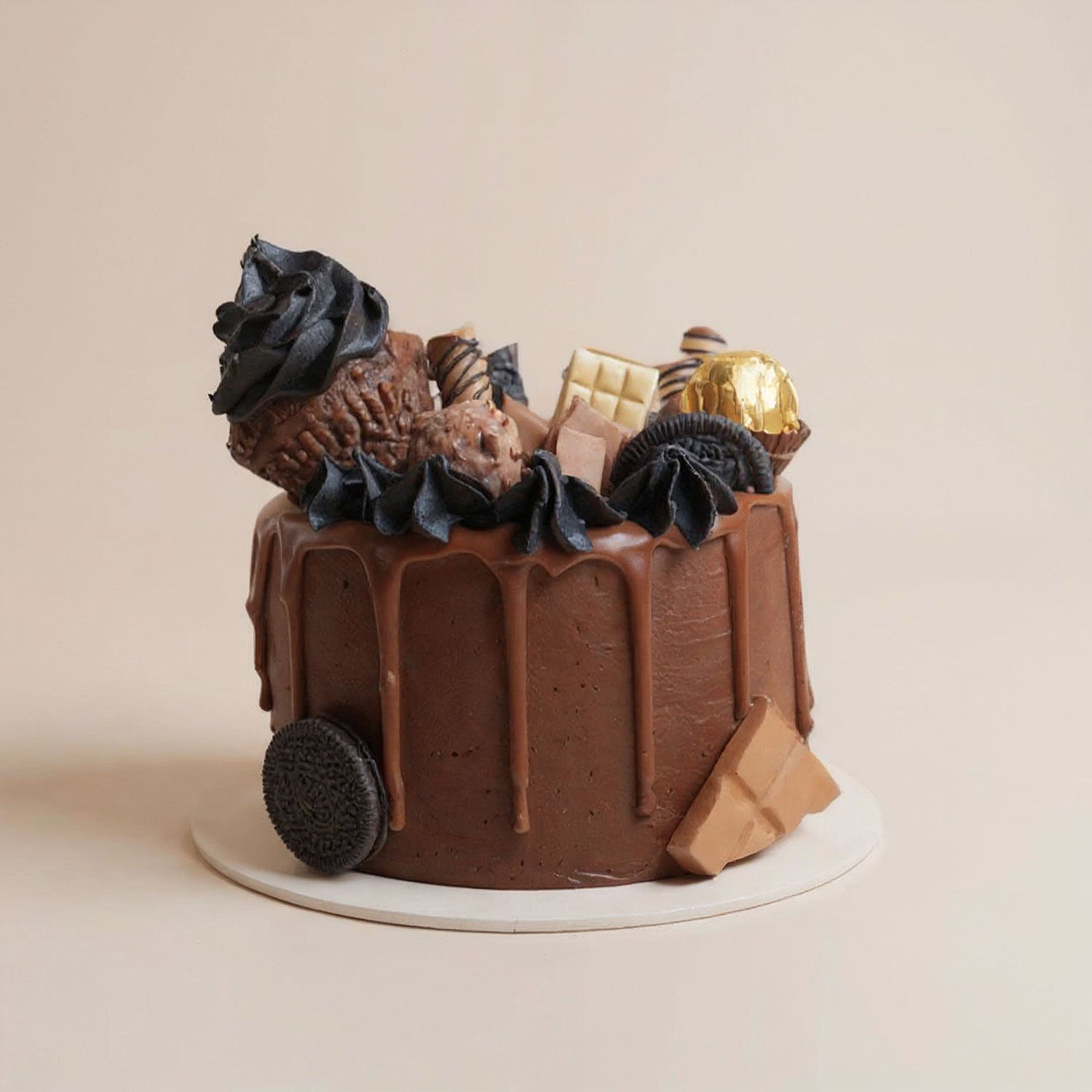 Chocolate cake with decorative elements on a beige background