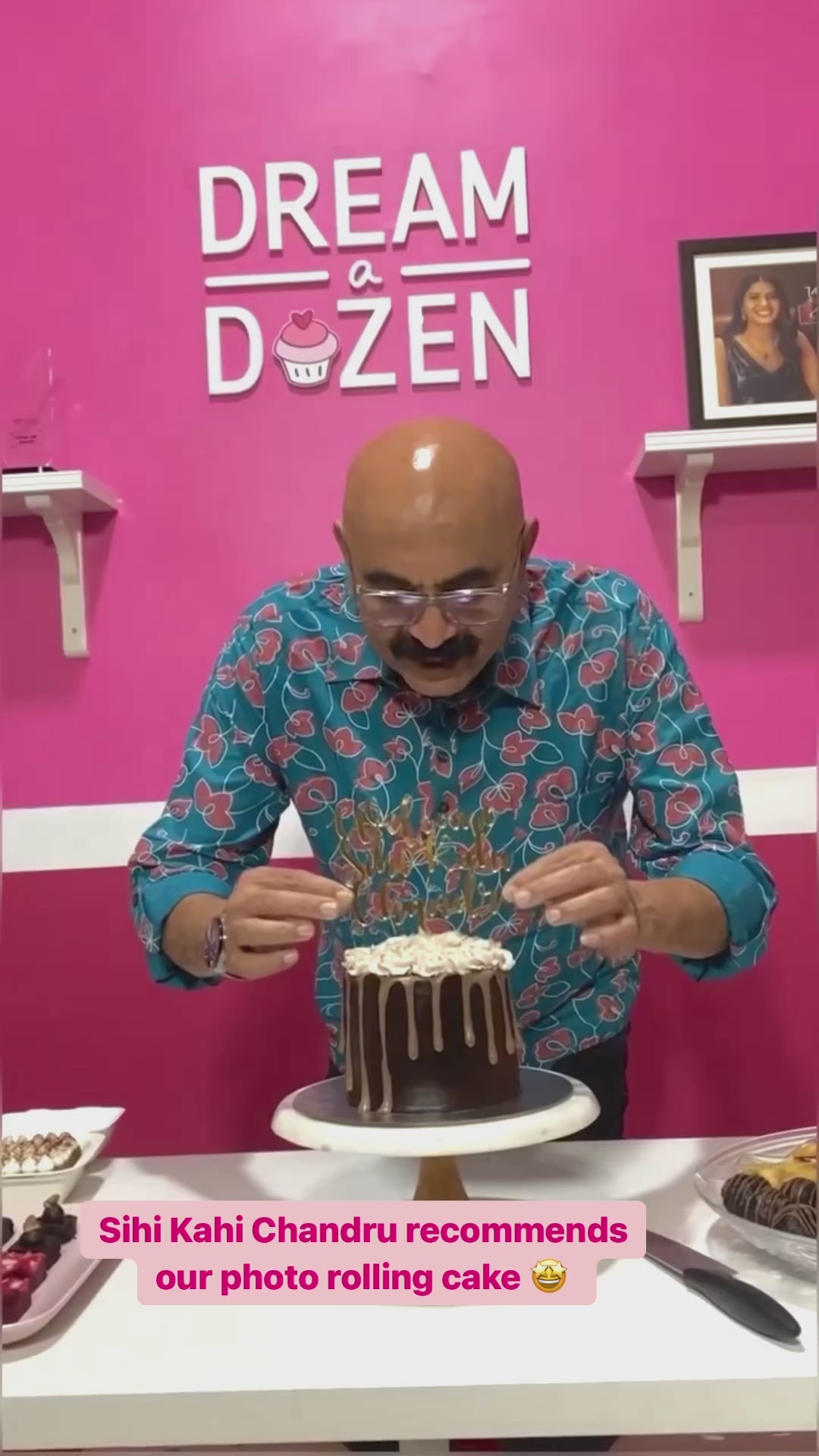 A video of a man revealing photos from a photo rolling cake
