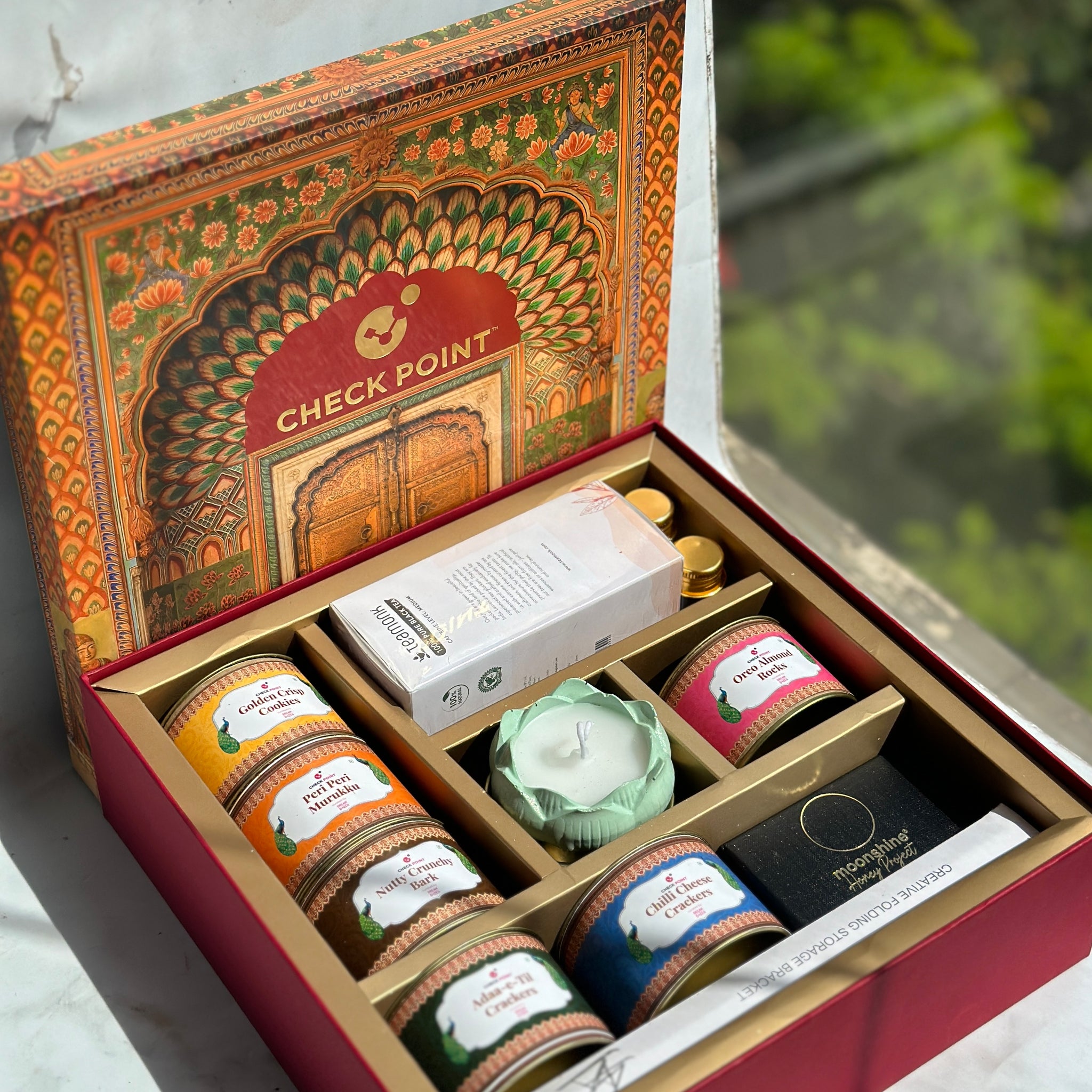 A 45 degree top angle shot of the customized luxury Diwali gift hamper ordered by Check Point in 2023