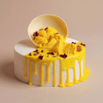 Yellow cake with white frosting on a beige background