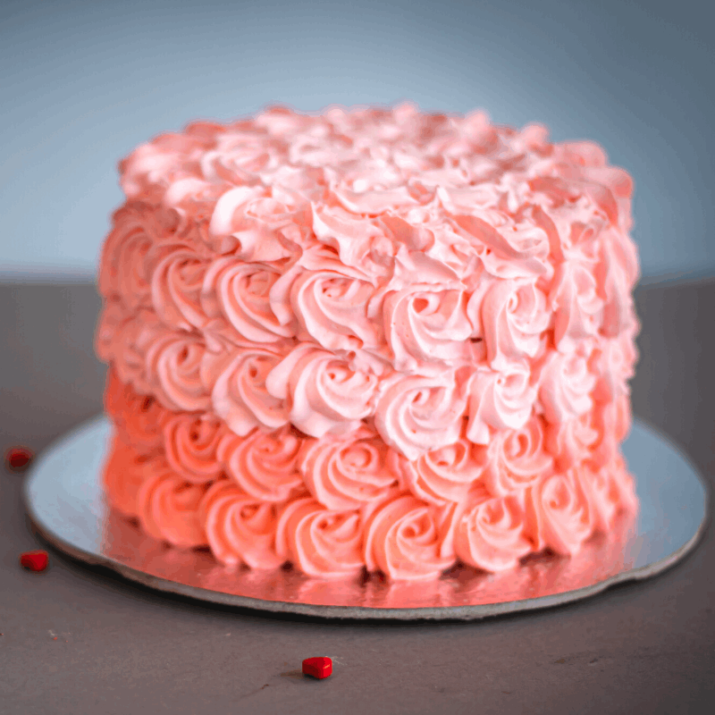 Dreamy rosettes frosted on a deliciously soft cake, decorated to suit your party colors!