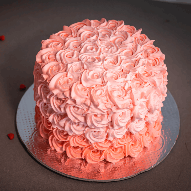 Dreamy rosettes frosted on a deliciously soft cake, decorated to suit your party colors!