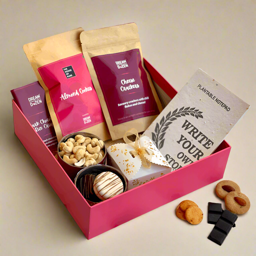 Gift box with cookies, crackers, and a card on a decorative background