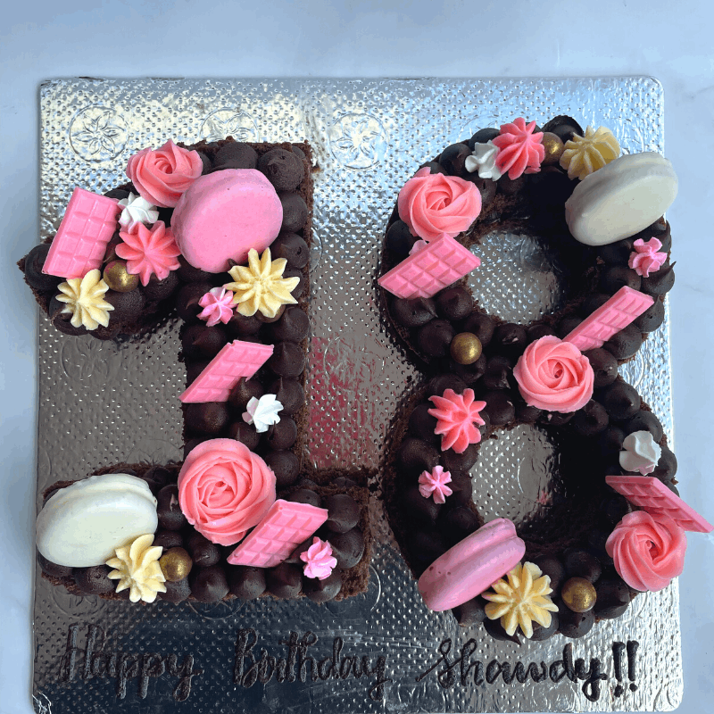Digit cake studded with chocolates and frosting