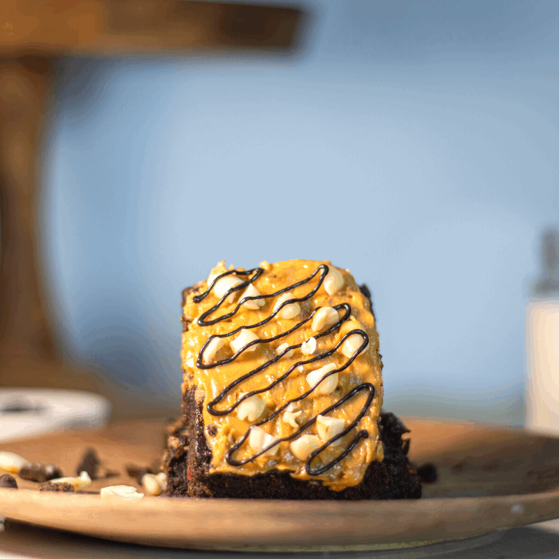 Peanut butter on chocolate brownie with roasted peanuts