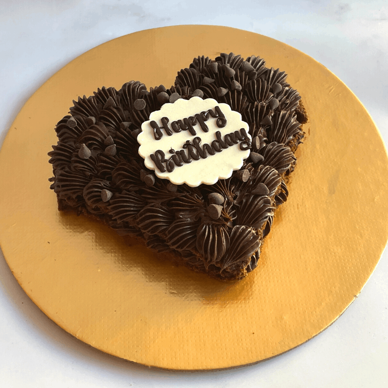 Cake inside the pinata shell with a sugar disk containing the caption you wish to have