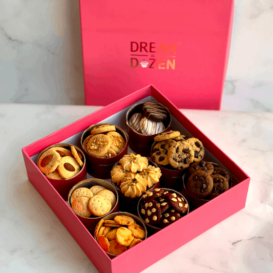 Nine varities of cookies. Reusable box. Chocolate. Cheese Crackers. Choco-chip. Rose pista. Salty cookies. 