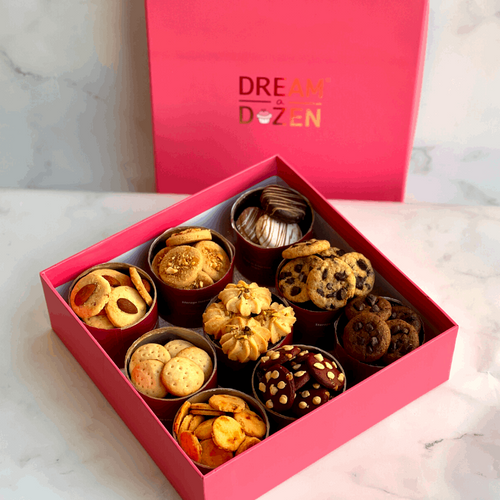 Nine varities of cookies. Reusable box. Chocolate. Cheese Crackers. Choco-chip. Rose pista. Salty cookies. 