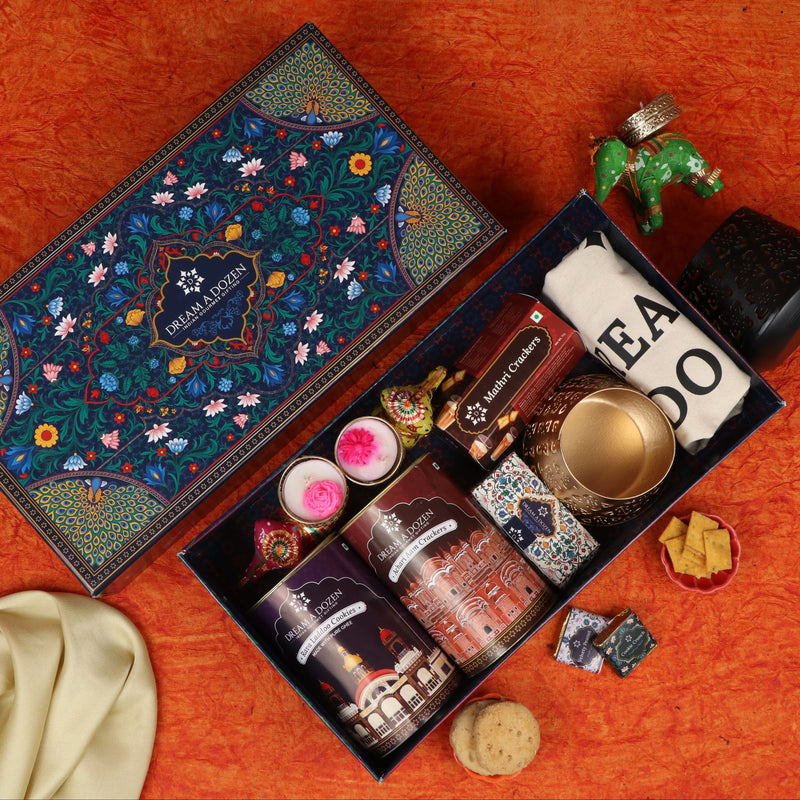 Decorative gift box with colorful packaging on an orange fabric background