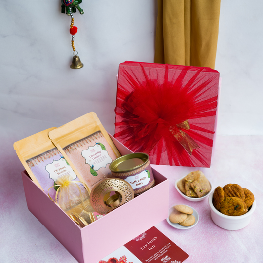 top down shot of our desi fusion festive wedding gift hamper. Ideal for wedding gifting, this hamper is designed to create a memorable gifting experience for your guests. best wedding gift hamper for family and friends under 1500. perfect for wedding return gift, personalised wedding gift.