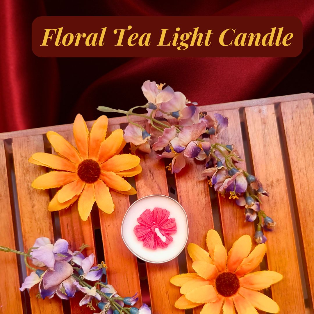 A cute, tiny tea light candle with an adorable wax flower around the wick