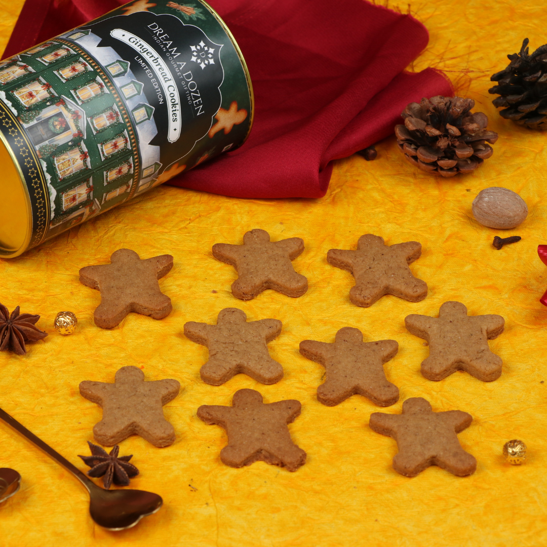 Star-shaped gingerbread cookies on a yellow surface with a canister labeled 'Dream of a Dozen'.