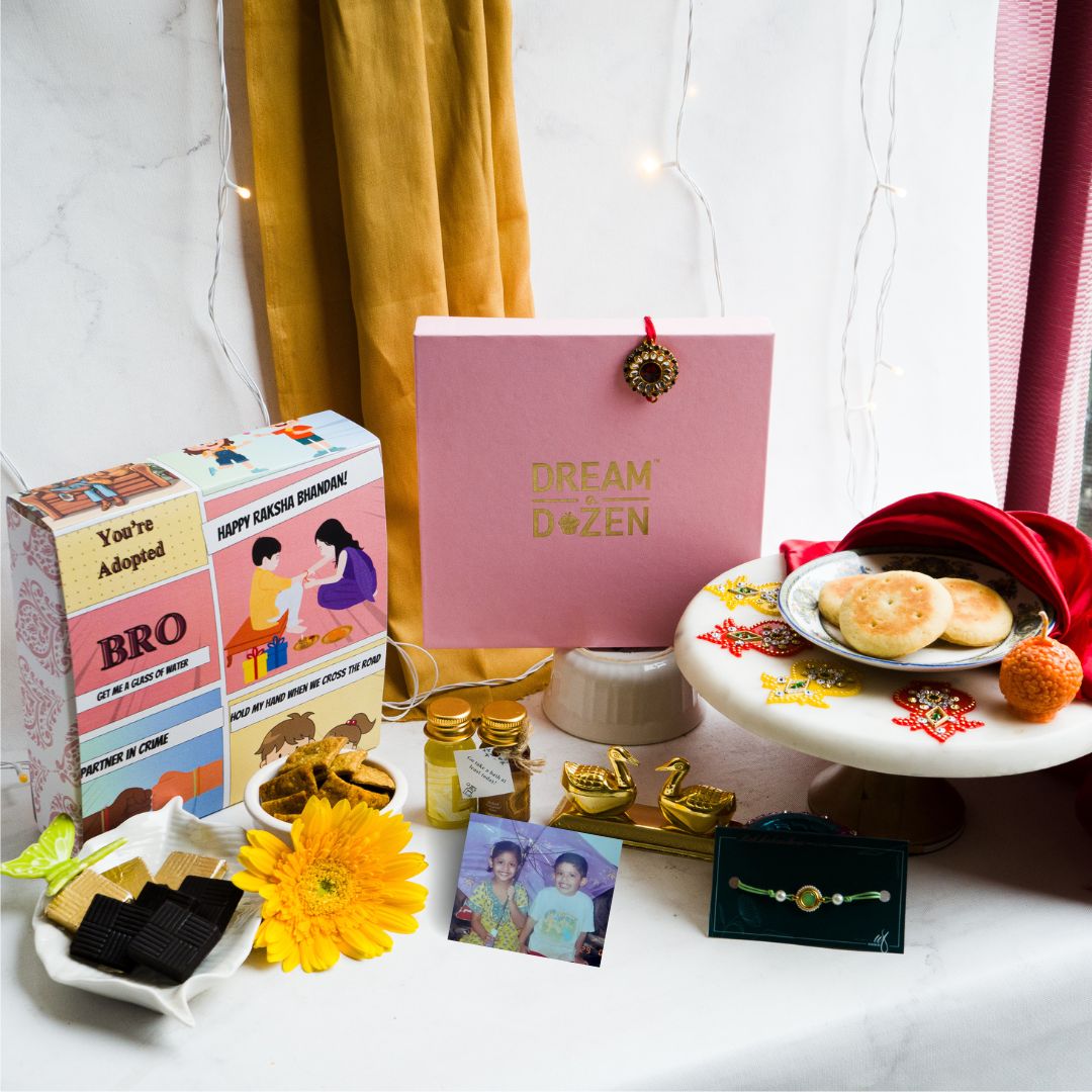Raksha Bandhan Gift for Sister and Brother | For siblings who playfully insulted each other. Taken from a top angle, the hamper features chocolates and jokes made at their brother and sister's expense, coffee mixes and Rakhi