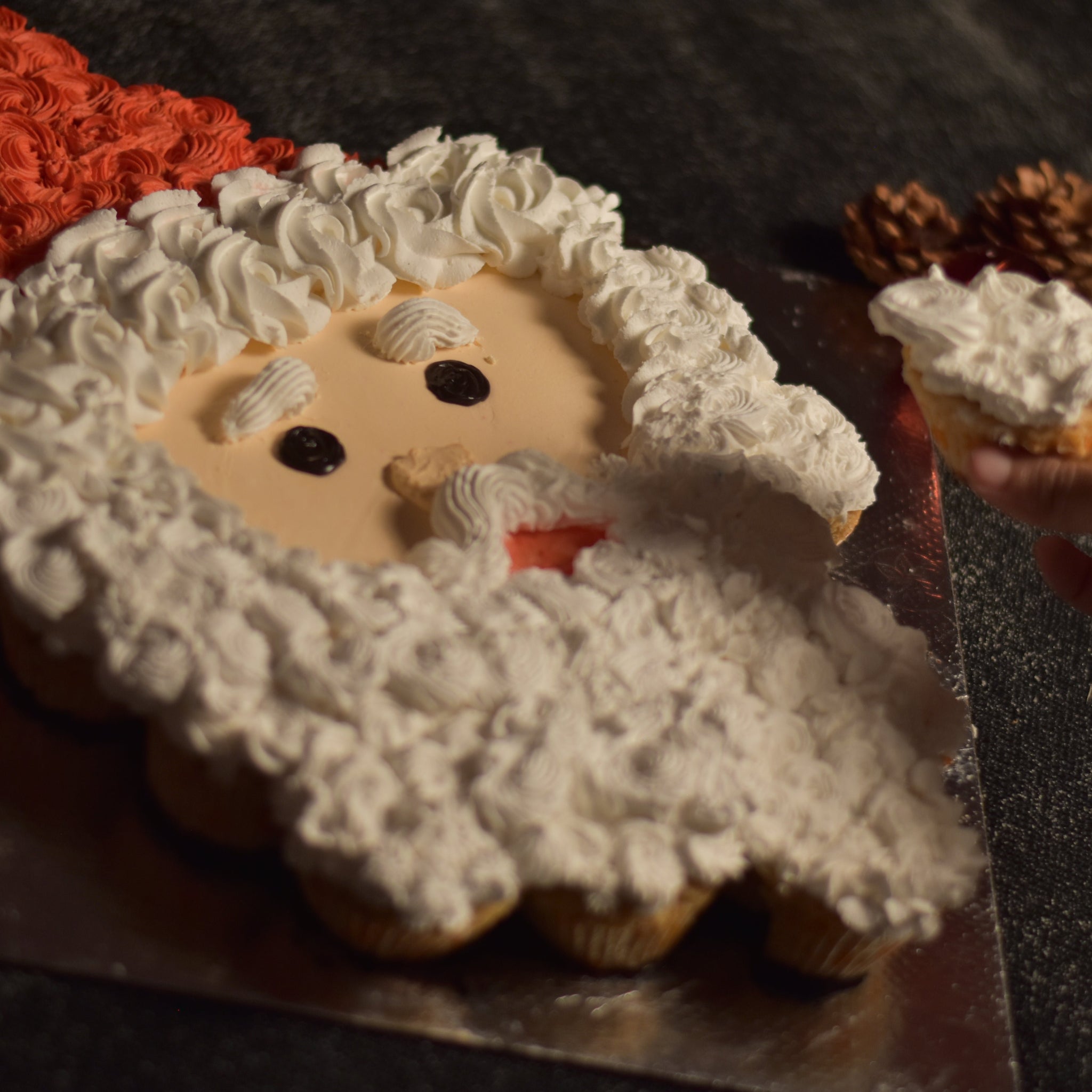 Our Santa Pull Apart cupcakes on a silver cakeboard are the best option for office secret santa parties  in bangalore office and workspace christmas parties