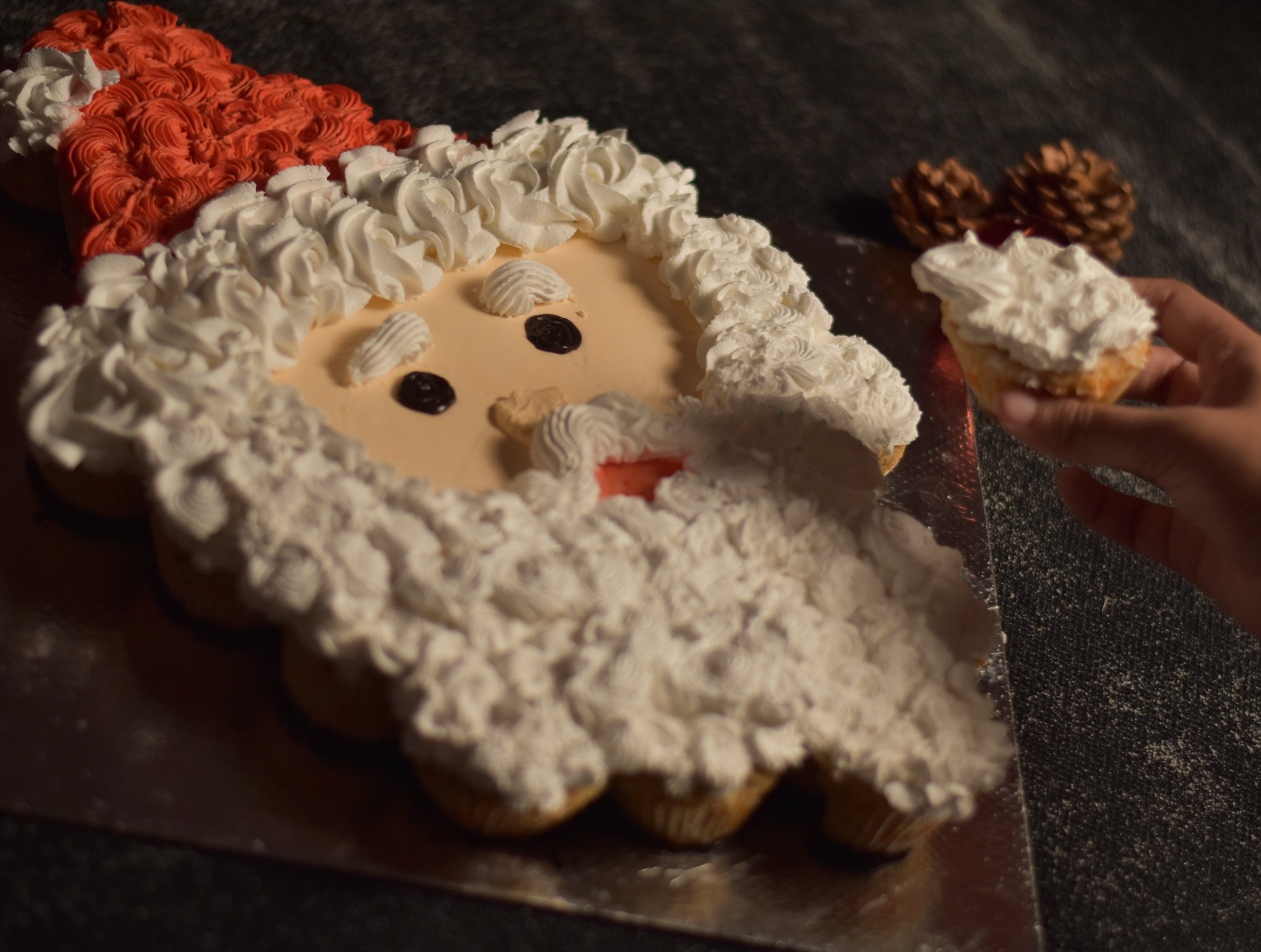 Our Santa Pull Apart cupcakes on a silver cakeboard are the best option for office secret santa parties  in bangalore office and workspace christmas parties