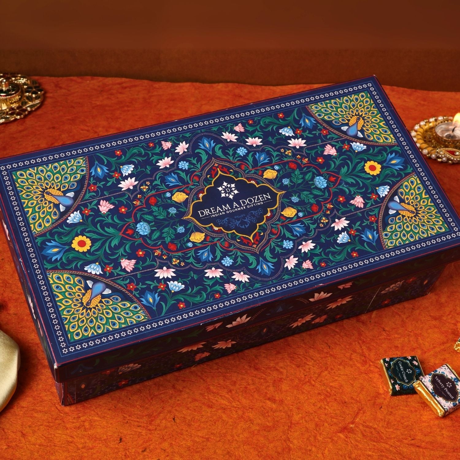 Decorative box with intricate floral patterns on a wooden surface
