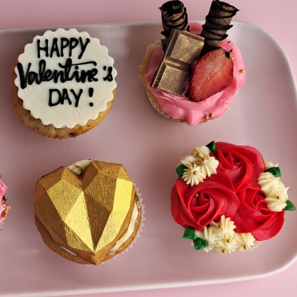 Valentine's Day-themed cupcakes on a pink plate