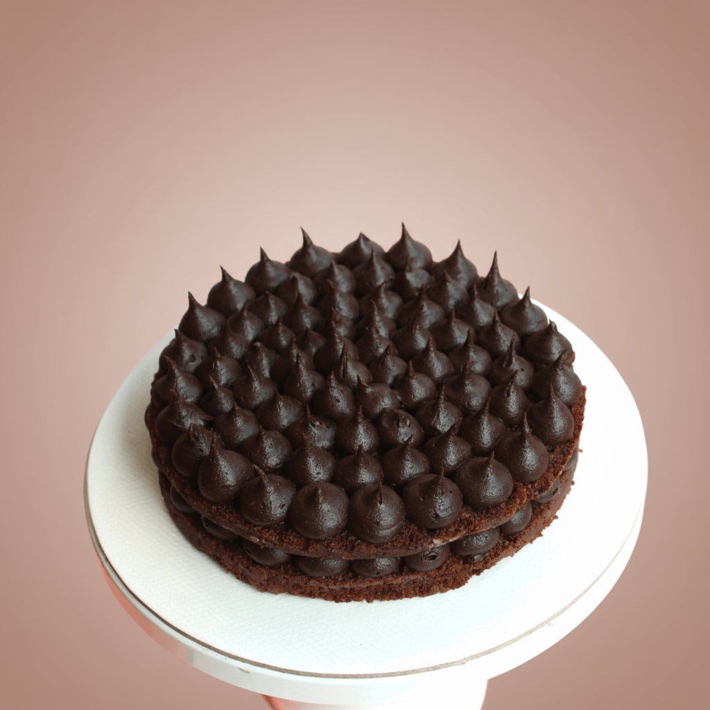 Chocolate cake with a unique texture on a beige background