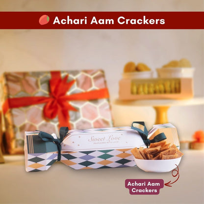 a close up front shot of a candy shaped packaging with a bowl of inviting achari aam crackers in front of it 