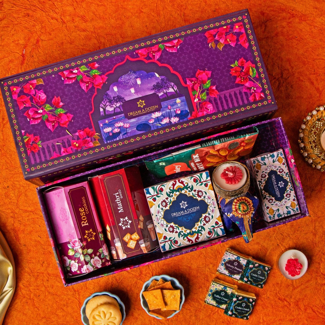 Decorative gift box with snacks on an orange surface
