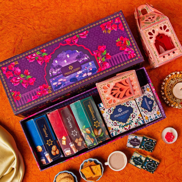 Decorative chocolate box with colorful packaging on an orange surface