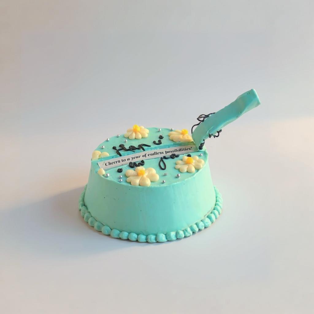 Turquoise cake with decorative elements on a white background