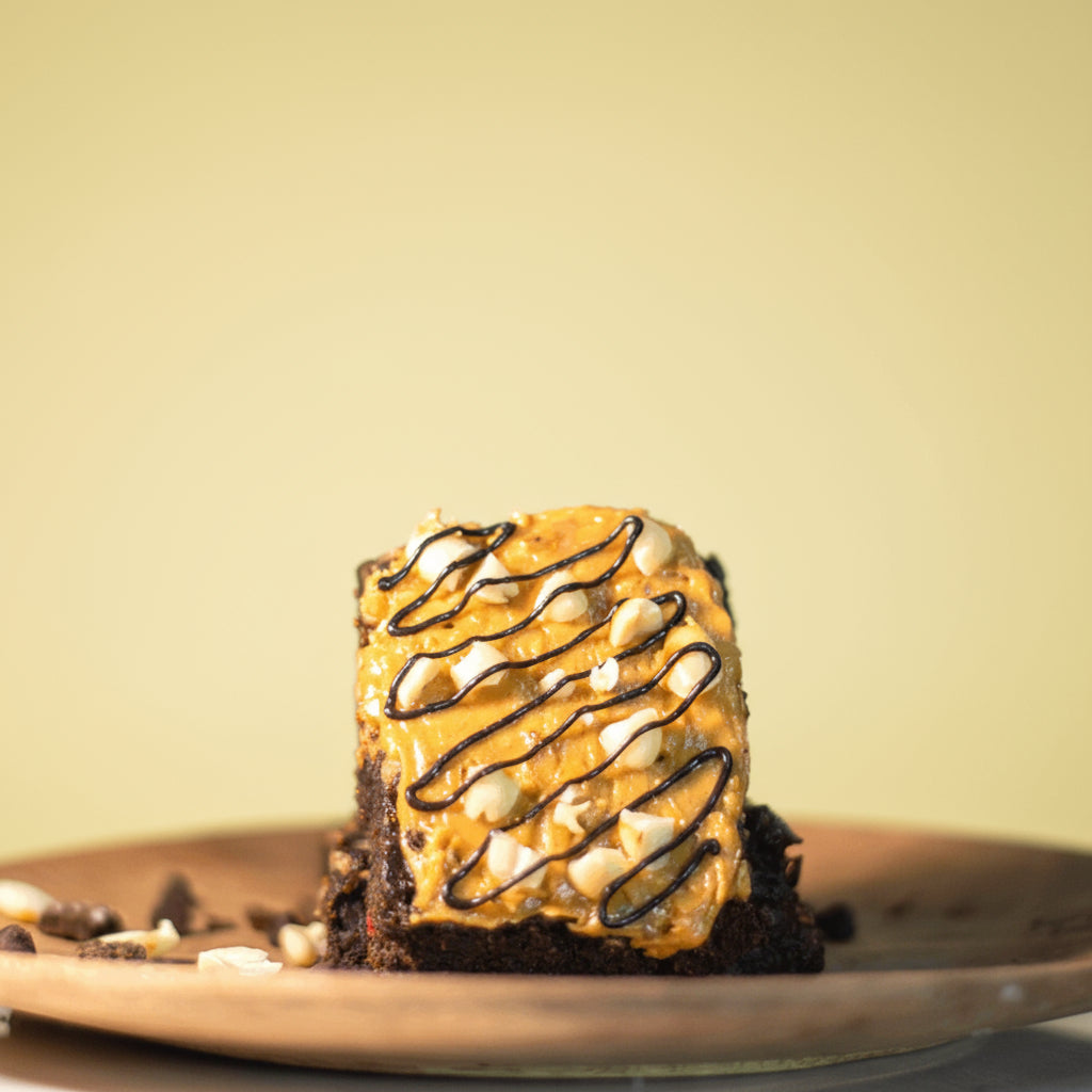 Peanut butter on chocolate brownie with roasted peanuts