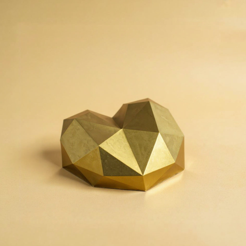 A golden Pinata heart cake