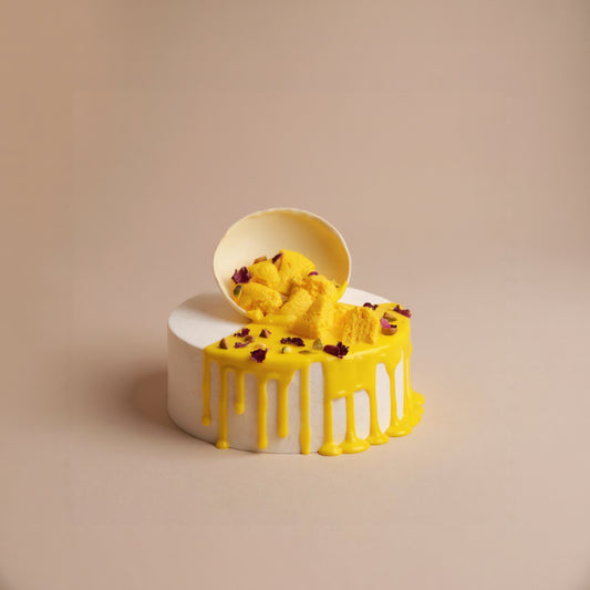 Rasmalai cake with a white base on a beige background