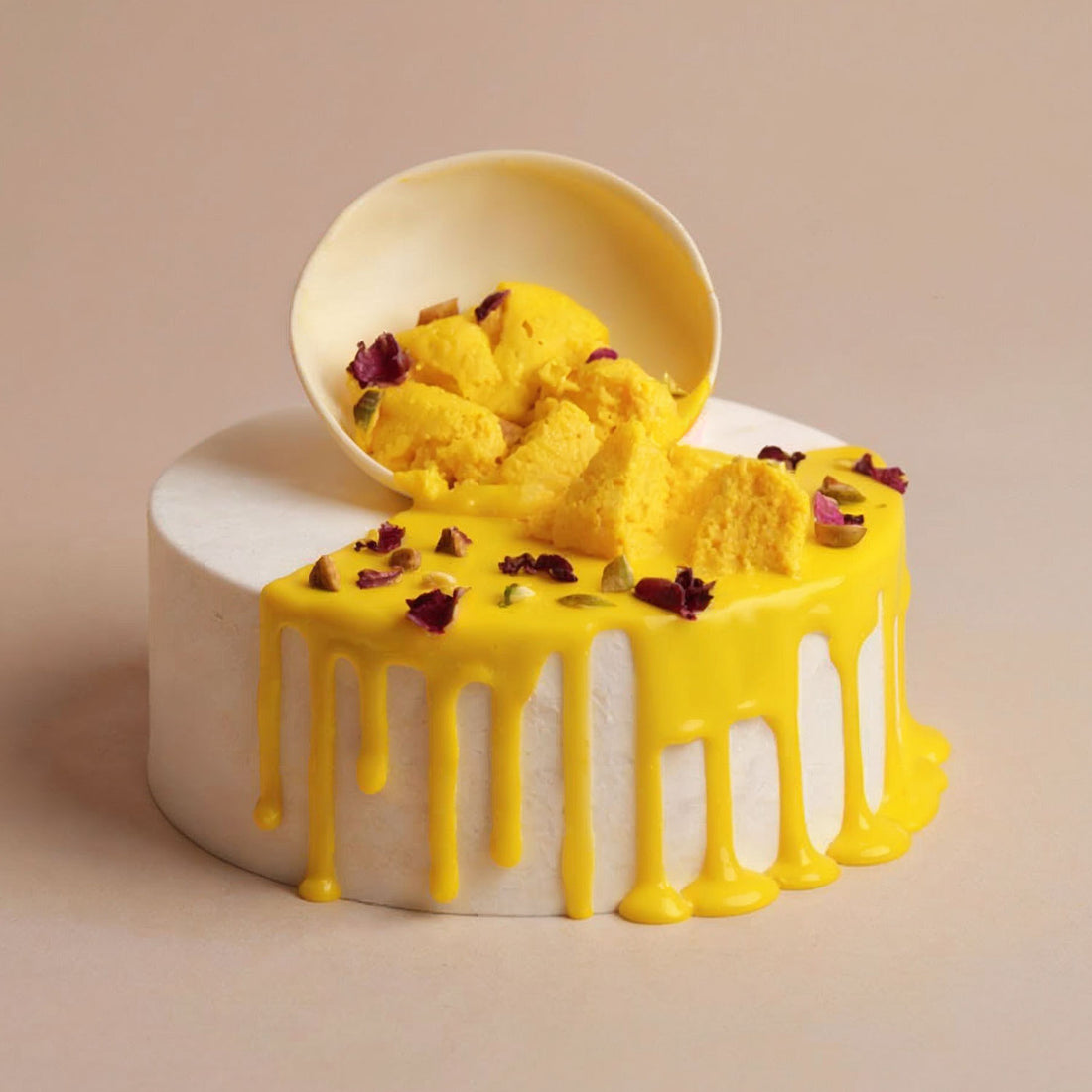 Yellow cake with white frosting on a beige background