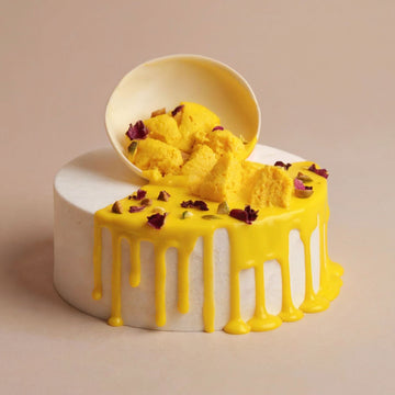 Yellow cake with white frosting on a beige background
