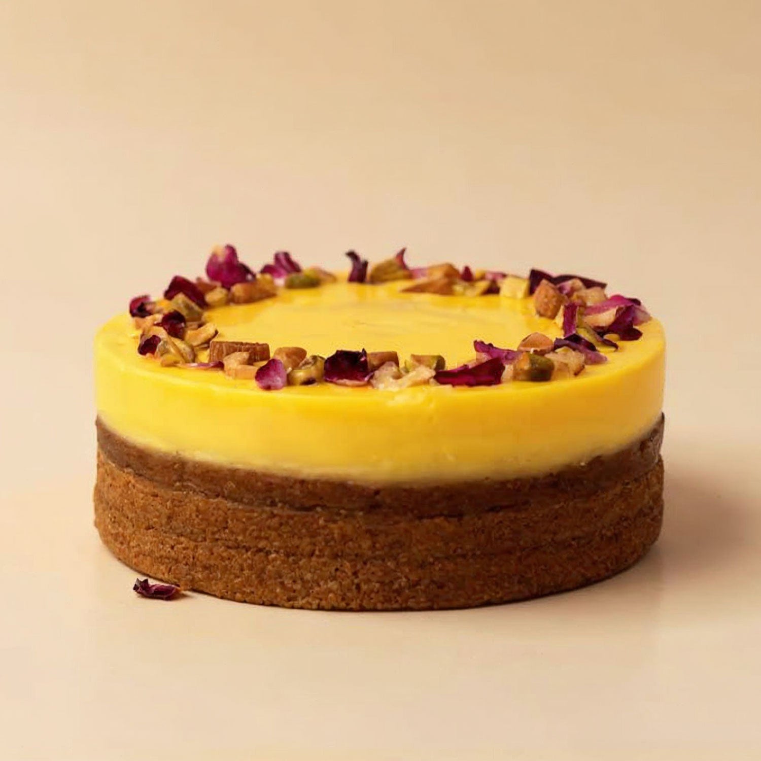 Yellow cake with a crumbly base on a beige background