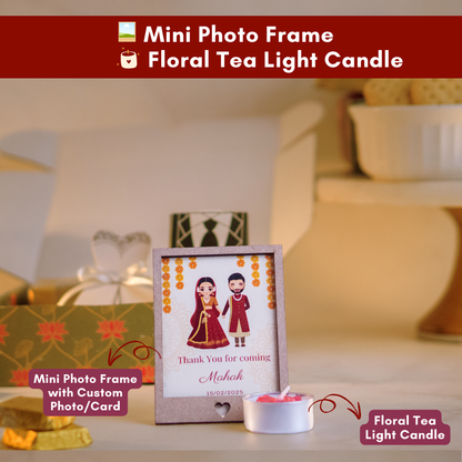 a close up front shot of a customisable mini photo frame and a floral tea light candle 
