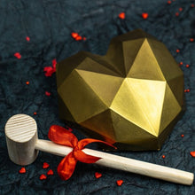Load image into Gallery viewer, Chocolate shell with cake inside with a hammer to shatter the golden chocolate cake outside
