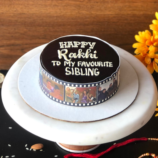 Straight shot of a Rakhi cake with a scroll of edible print photos of the FRIENDS TV show. Completely eggless in our best selling cake flavour, Chocolate truffle.